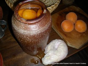 Preserved apricots in stoneware crock and bladder