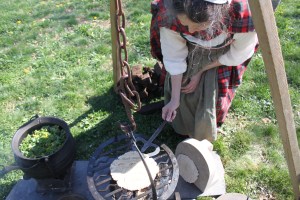Turning a bannock on the barred girdle with a spade