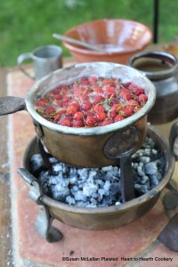 After skimming the mixture of strawberry juice, sugar and water for the receipt (recipe) "For preserving Strawberries" put as many strawberries as you can stems up into the sauce pan without bruising them.