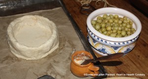 The coffin is built for the receipt (recipe) "To bake preserved Gooseberries in Pies" by boiling hot water, melting butter in the water and adding flour until it is the correct feel for a standing crust.  In the small yellow glazed vessel is a mixture of flour and water used to seal the coffin.