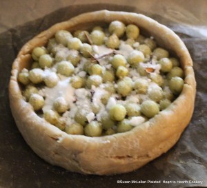 After the cloves and cinnamon are put on the gooseberries for the receipt (recipe) "To bake preserved Gooseberries in pies" put on a good store of refined sugar.