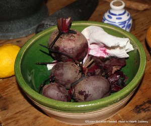 After the beet roots have been boiled tender and cooled for the receipt (recipe) "To make Crimson Biscuit of Red Beet-Roots", clean them by removing the remaining stalks and peel with a cloth.