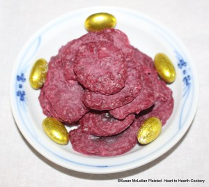 The receipt (recipe) "To make Crimson Biscuit of Red Beet-Roots" is a confection prepared with beets, sugar, butter of egg yolks, flour, cinnamon, orange flower water and lemon juice and dried in an oven.  Pictured it is ready for presentation garnished with gilded almond comfits.