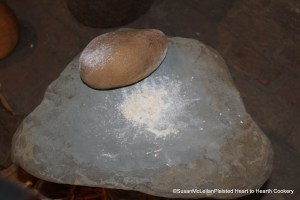 After the slice sunchokes (Jerusalem artichokes) slices are dried on the drying rack, a stone is used to grind them into flour.