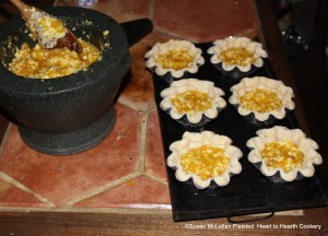 After the orange-flower water is added and all mixed well together in the mortar and pestle to prepare the receipt (recipe) " To make Orange Cheese Cakes" sheet your tins with puff-paste and half fill them.