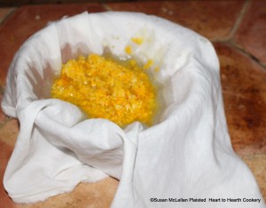 While the dissolved isinglass is cooling for the receipt (recipe) "To make Orange Jelly" strain the grated rinds from the China oranges, Seville oranges and lemons that have been steeping in the juice of nine Seville oranges.