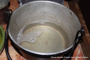 After weighing two ounces of isinglass for the receipt (recipe) "To make Orange Jelly" it is well boiled in a quart of water.  The isinglass is completely dissolved.