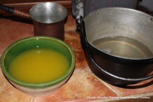 After the grated rinds of two China oranges, two lemons and two Seville oranges has been strained from the Seville orange juice for the receipt (recipe) "To make Orange Jelly", mix the strained juice with the cooled isinglass dissolved in boiling water.
