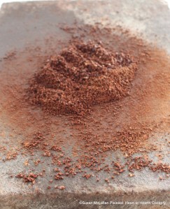 The cacao nibs were placed on a heated stone (a metate) to grind the nibs and melt the cacao butter for the chocolate cake to make the receipt (recipe) "To make Chocolate with Water".