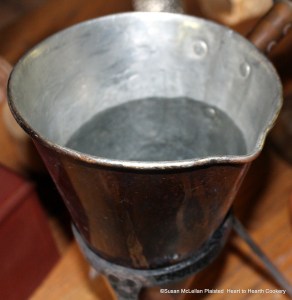 The first step to prepare the chocolate beverage receipt (recipe) "To make Chocolate with Water" is to take a "Quart of Water". I am using a reproduction mulling cone supported by a brandreth.