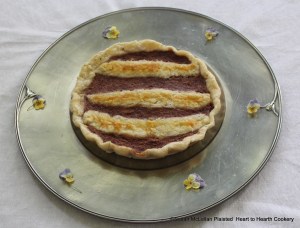 Pictured is the receipt (recipe) To make a tarte of strawberyes presented to table.  The receipt reads: Take and strayne theym wyth the yolkes of foure egges, and a little whyte breade grated, then season it up wyth suger and swete butter and so bake it.  A Proper New Booke of Cokerye (author unknown).