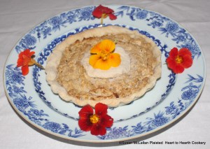 When the receipt (recipe), To make Potato-Pudding was presented to table it was elegant garnished with edible nasturtiums.  The pudding consists of potatoes mashed to a pulp, chopped apples, cream, sugar, cinnamon and cloves baked in a paste (pie crust).