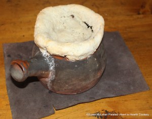 When the pot covered with paste (pastry) was removed from the bake oven for the receipt (recipe) To Butter Onions Otherways the paste had sunk and there was a tear but the aroma of the mixture of minced onions and sliced apples was heavenly.  