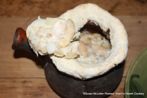 After the pot with the receipt (recipe) To Butter Onions Otherways was removed from the bake oven, a circle of the baked paste lid was cut to reveal the baked minced onions and sliced apples.  The aroma was delightful but unfortunately I am not able to share