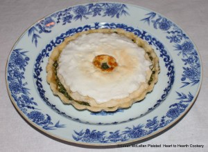 The receipt (recipe) Green Peas Tart prepared from boiling green peas, seasoning them with salt, saffron, butter and sugar, baking and then icing the tart is ready for the table.