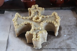 After the sliced lemon is laid in the coffin for the receipt (recipe) A Hen Pye close the pye.  The lid is placed on the coffin, decorated with more coffin paste and the details highlighted with an egg yolk wash.