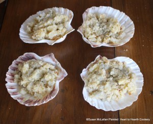 After the boiled, cut salsify has been mixed with grated bread crumbs and butter for the receipt (recipe) Stewed Salsify fill scallop shells with the mixture.