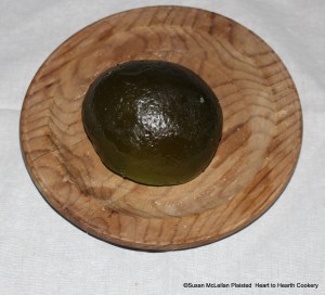 After a pound of pared Forelle pears have been weighed on a balance scale to obtain two pounds of sugar for the receipt (recipe) Marmolett of popling-pare, the sugar and pears are heated with a soft fire till the suger be well melted (no water), boyle them, scum them, keepe them with continuall sturning (stirring) and put in some slices of green sittarn. An imported candied citron (sittarn) is pictured.