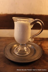 In addition to the froth (silly bubbles) put in a Sillibub pot for the receipt (recipe) To make a very fine Sillabub, some of the froth was put into a hand-blown  jelly glass so that the results of the mixture setting for twelve hours could be seen.  If you look closely at the picture, you will see that liquid has settled at the bottom of the glass from the froth.