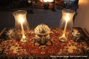 The posset pot is in the center of the table with the sillabub pots symmetrically placed on either side of the table.  The sillabub pots have been filled with the froth (silly bubbles) from the receipt (recipe) To make a very fine Sillabub and both pots set for twelve hours.