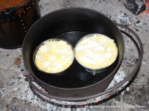 After the slices of bread and bits of butter have been laid on top of receipt (recipe) To make a White Pot bake it.  The white pot receipt was prepared in two tin pans and baked in a bake kettle.