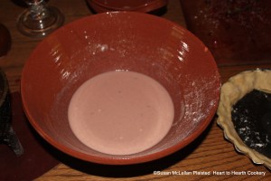 The pudding is ready to be poured into the dish with paste about the brim for the receipt (recipe) A Goose Bery Pudding. The ingredients in the pudding are boiled gooseberries strained, melted butter, cinnamon, nutmeg, brandy, some flour, white sugar, eggs and some whites, rose water, and new milk.