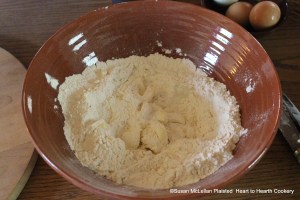 After the flour has been measured for the receipt (recipe) To make Wigs rub butter into the flour until none of it be seen.  Since I prepared one-third of the actual receipt, the picture shows a quarter pound of butter.