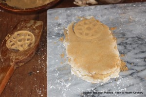 After the sugar plate cake and almond paste layer was covered with the other sugar plate cake for the receipt (recipe) To make White Gingerbread then strew fine ginger above and beneath and molde.