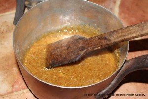 After the honey has been clarified and bread grated for the receipt (recipe) To make Gingerbrede caste it (the grated bread) into e boylenge hony & stere it well togyder faste with a sklyse (wood spatula).
