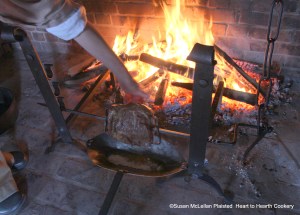 The first instructions for the receipt (recipe) To roast a Shoulder of Mutton was roast it with a quick fire.  A good bed of embers is being established to provide a quick roasting temperature and I am feeling the heat coming to the roast with my hand to make certain.