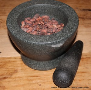 The first step in Penelope Jephson's circa 1674 manuscript receipt (recipe) To make Chocolate is to take a pound of cacao nut. Since I am making half the receipt, there is one-half pound of fermented trinitario cacao beans in the mortar and pestle ready to be ground.