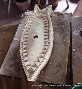 After the dates, grapes, raisins and lemon are laid in the coffin for the receipt (recipe) To Bake a Carp otherways to be heaten hot close it up with a lid.  The lid is prepared to look as close as possible to a diagram in the receipt book with a deliberate hole for the addition of a mixture of verjuice (fermented crabapple juice), butter, sugar and white wine which is added when the coffin is almost baked.