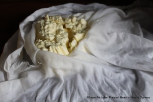 When the curd in the cloth for the receipt (recipe) Fresh Cheese and Creame stopped dripping of whey, the cloth was opened to reveal the curd (the fresh cheese) ready for the next step.