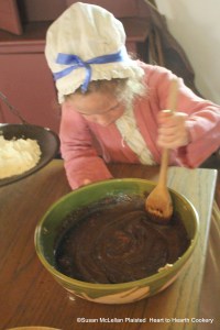 After the flour has been weighed for the receipt (recipe) Gingerbread, my granddaughter stirred in half a pint of molasses. The flour was added slowly after the molasses was completely mixed.