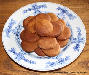 The 18th century manuscript receipt of Jane Paxsen Parry, Gingerbread, is plated for the table.  The ingredients are flour, butter, one ounce of ginger, a small quantity of cinnamon, all spice and cloves, and molasses.