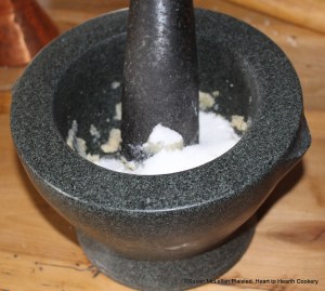 After the rind of a Seville orange has been beat in a mortar for the receipt (recipe) To make the Orange pudding put to it four ounces of fine sugar.  Since I am preparing half the receipt pictured is two ounces of fine sugar added to the beaten rind.