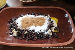 The last ingredient to layer in the platter for the receipt (recipe) Another Forc't' Dish is an ounce of cinnamon. The layers from bottom to top now are diced marrow, diced dates, prunes, currants, yolks of eggs, sugar and cinnamon.