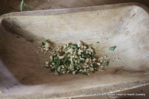 After the horseradish has been pared for the receipt (recipe) A made dish of Parmizant mince same Tarragon together with Horse-Radish.  Pictured are equal amounts of tarragon and horseradish minced in a wood bowl with a rocker knife.