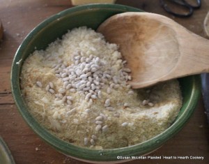 After the minced tarragon and horseradish have been added to the grated Parmesan cheese and bread for the receipt (recipe) A made dish of Parmizant season this with almost a handful of Carraway Comfits.  I make my caraway comfits using a comfit pan and can add twelve layers of a sugar solution boiled to the first degree in one day and then need to let them rest.  Pictured are caraway comfits that have sixty layers of sugar.