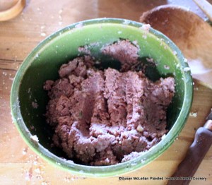 After the handful of caraway comfits have been mixed with the grated parmesan cheese, manchet, minced tarragon and horseradish for the receipt (recipe) A made dish of Parmizant, put to it a little brisk Claret-wine to moisten it over.