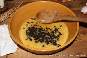 After the sugar and rosewater have been added to the beaten eggs for the receipt (recipe) To make little plum puddings: My Lady How's Receipt put in a few courance.  I added a handful of currants.