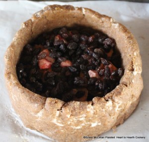 After the marrow was added to the coffin for the receipt (recipe) To make a Potato Pye add...a handful of stoned Raisins of the Sun.  Fortunately, I did not have to remove each seed from the raisins as I used seedless for this receipt but frequently I show the process with seeded raisins.