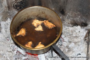 After the pan of hogs-lard is boiling hot for the receipt (recipe) Skirret Fritters drop them in with a spoon and fry them quick and brown.