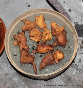 After the batter for the receipt (recipe) Skirret Fritters has been dropped with a spoon into a pan of hot lard and fried brown put them on a sieve before the fire to drain a minute.