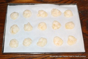 After the mashed quince pulp, sugar, and frothed egg white have beat together to look as white as snow for the receipt (recipe) Quince Puffs: my Lady Sheldons Receipt drop it with a spoon upon plates.  My tin plate is covered with white paper prior to baking the Quince Puffs.
