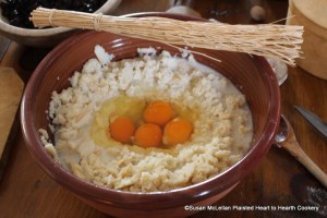 After grating a half a nutmeg into the bread soaked with milk for the receipt (recipe) A plum puding Boyled break in 4 eggs whites and all.  The eggs will be whisked in the center of the bread with the birch twig whisk.