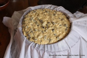 After the currants and raisins have been added to the batter for the receipt (recipe) A plum puding Boyled stir all together and put it in a cloath.  When using a pudding bag (a yard square of linen) I use a round colander to prepare the bag.