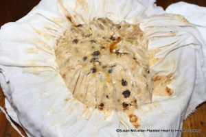 After the receipt (recipe) A plum puding Boyled has boiled for three hours in a linen pudding bag, it needs to be hung to rest above a kettle as the bag continues dripping.  I allow at least an hours rest before untying the bag and opening.  If it is not hung, the pudding will lose its characteristic round shape for service.