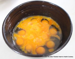 After four pounds of butter have been been beat until it is as fine as cream for the receipt (recipe) Nun's Cake then beat 35 eggs, leave out 16 whites.  Pictured is only half the total eggs as the receipt was prepared in two bowls.