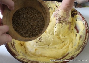 After the orange flower water, flour, and sugar have been mixed in the batter for the receipt (recipe) Nun's Cake take ounces of carraway-seeds and strew them in beating it up all the time.